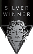 Designing Digitally - A silver triangular award with an illustration of a woman's face and the text "SILVER WINNER" above it, all About Designing Digitally. Designing Digitally -