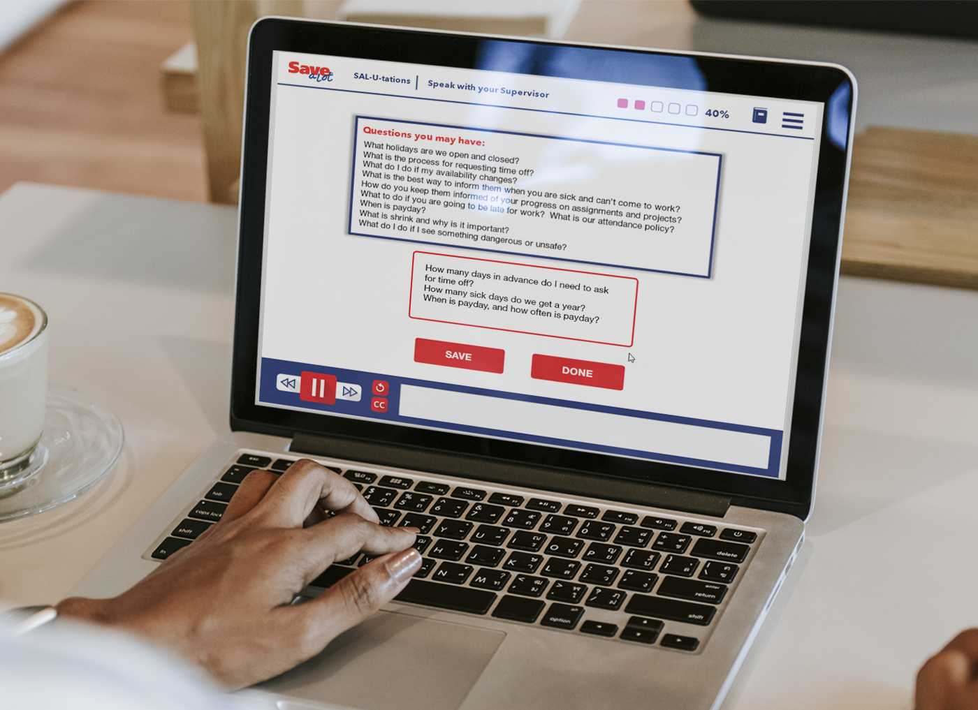 Designing Digitally - Person using a laptop displaying an "eLearning Vendor" interface, focusing on a feedback form, with a coffee cup beside the laptop on a wooden table. Designing Digitally -