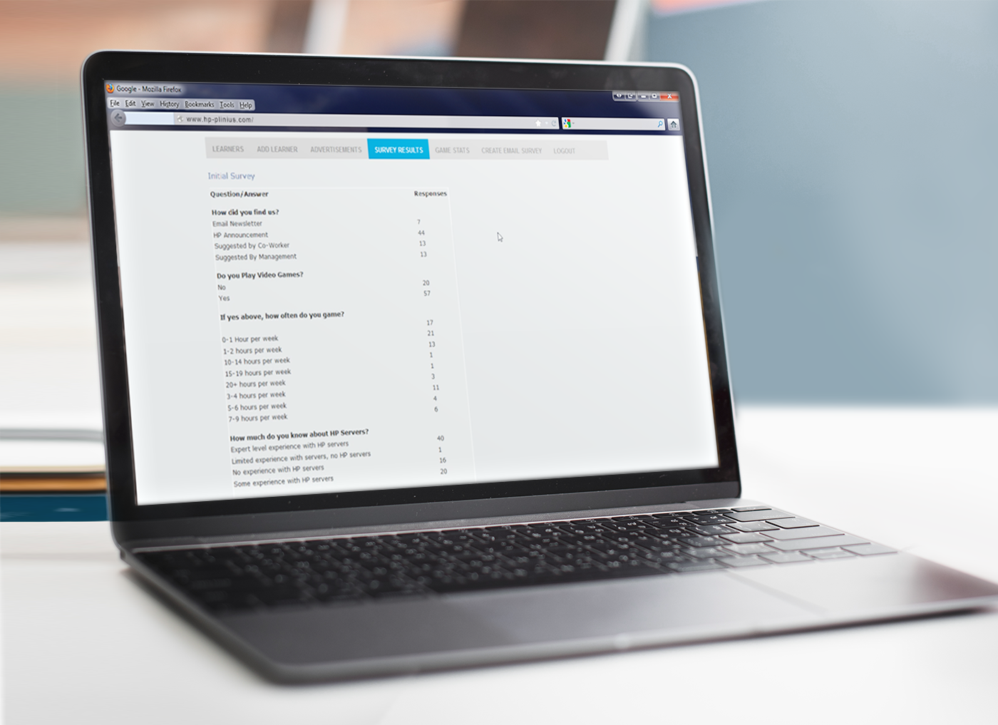 A laptop displaying an immersive technical training survey form with various questions.