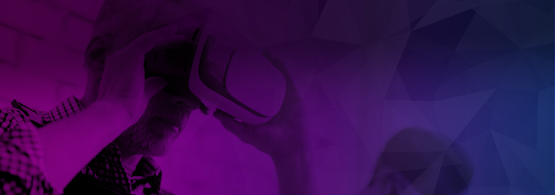 Man using a virtual reality headset for training with an abstract geometric background in the Manufacturing & Engineering industry.