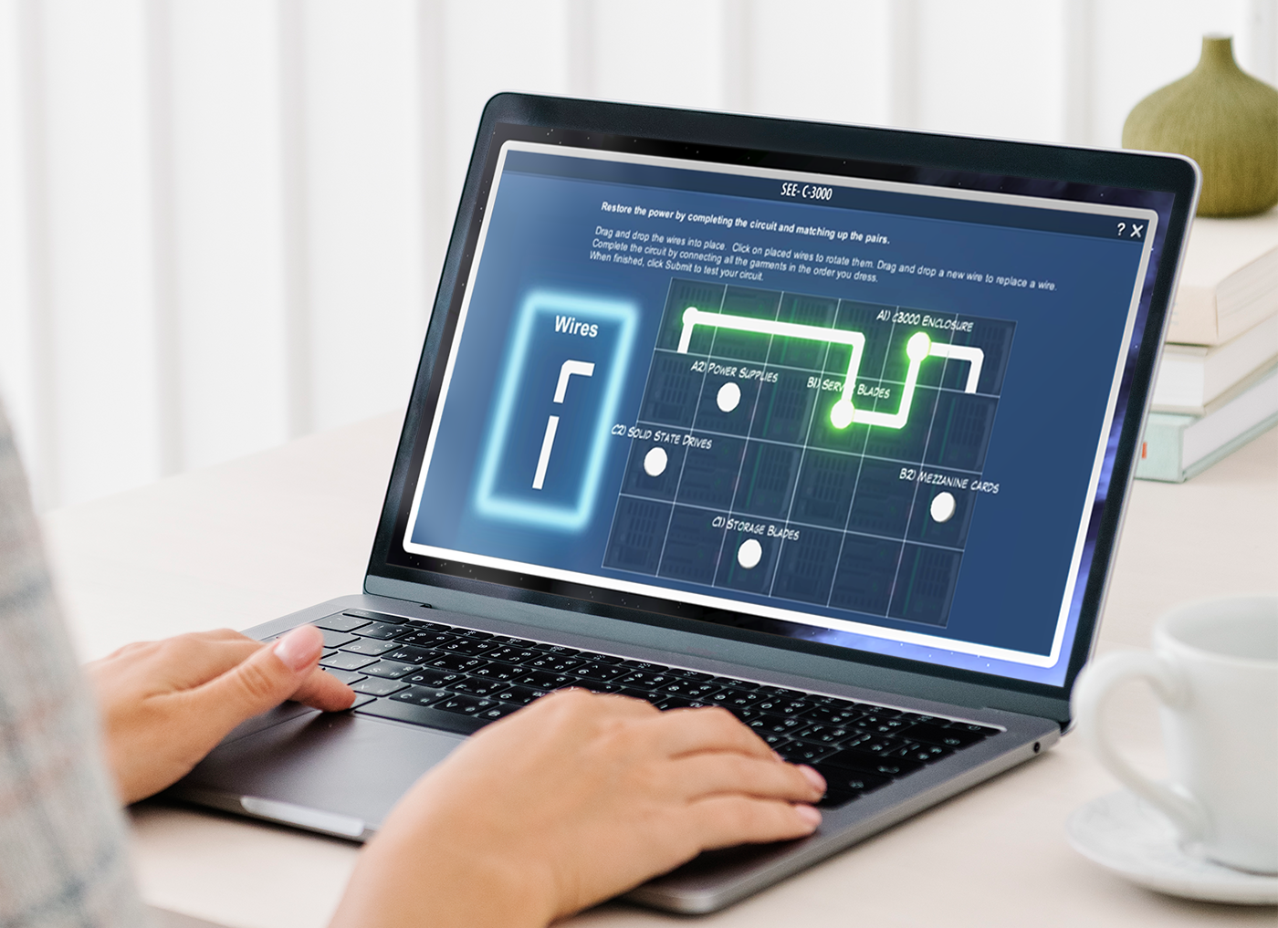 A person undergoing technical training using a laptop with an immersive schematic diagram displayed on the screen.