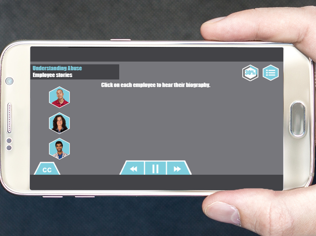 Designing Digitally - A hand holds a smartphone displaying an interactive screen titled "Understanding Abuse: Employee Stories & Drug & Alcohol Training Program," featuring three employee icons to click for biographies. Designing Digitally -