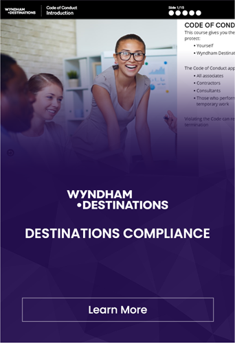 Corporate compliance training session with an attentive group and a smiling presenter at Wyndham Destinations.