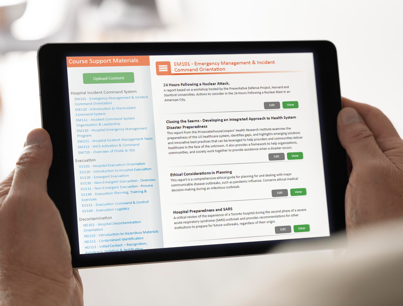 Designing Digitally - Two hands holding a tablet displaying an emergency management eLearning course with a list of module titles and descriptions. Designing Digitally -