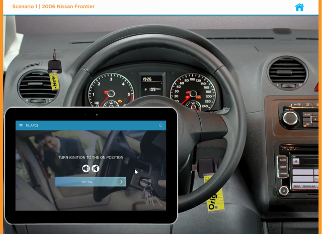 Designing Digitally - A vehicle dashboard with a 2006 Nissan Frontier steering wheel and instrument panel. As part of the Key Technician Onboarding, a tablet mounted to the steering wheel displays instructions to "Turn ignition to the on position. Designing Digitally -