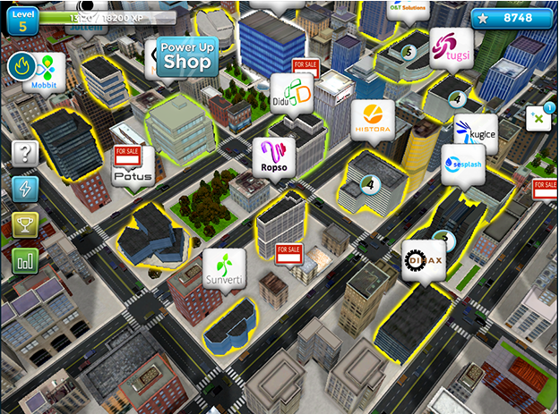 Designing Digitally - Aerial view of a vibrant, colorful virtual reality city from a mobile game, displaying various buildings, streets, and icons indicating game activities and shops. Designing Digitally -