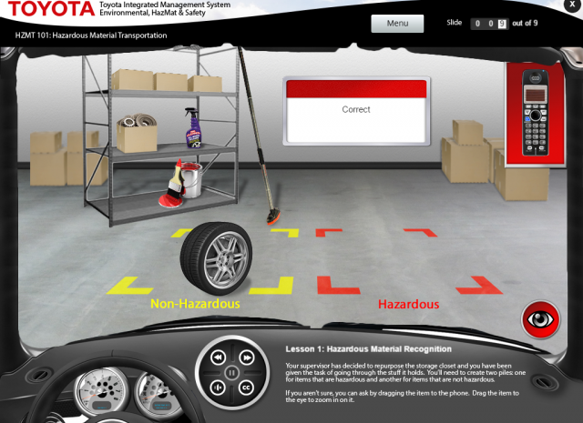 Designing Digitally - A training screen within the Online Hazardous Materials Training Program shows hazardous material transportation. It features shelves with items, a tire labeled "Non-Hazardous," and a box labeled "Hazardous." A pop-up indicates a correct answer. Designing Digitally -