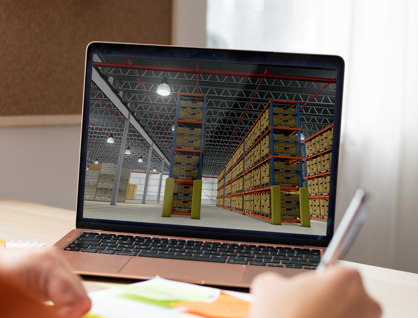 Designing Digitally - A laptop displaying a 3D rendering of a warehouse with rows of shelves stocked with goods, viewed over a person's shoulder who is taking notes for an eLearning Vendor. Designing Digitally -