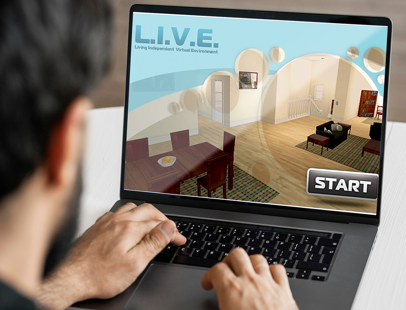 A man is using a laptop to engage in Occupational Therapy simulations.