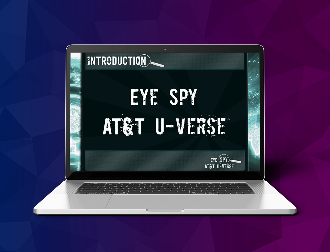 Designing Digitally - Laptop screen displaying the title "INTRODUCTION EYE SPY AT&T U-VERSE" against a geometric background, seamlessly incorporating Trauma Nurse Training Simulations. Designing Digitally -