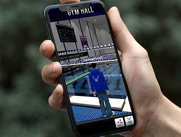 A person at the USAFA holding a cell phone showing a swimming pool in the web-based metaverse.