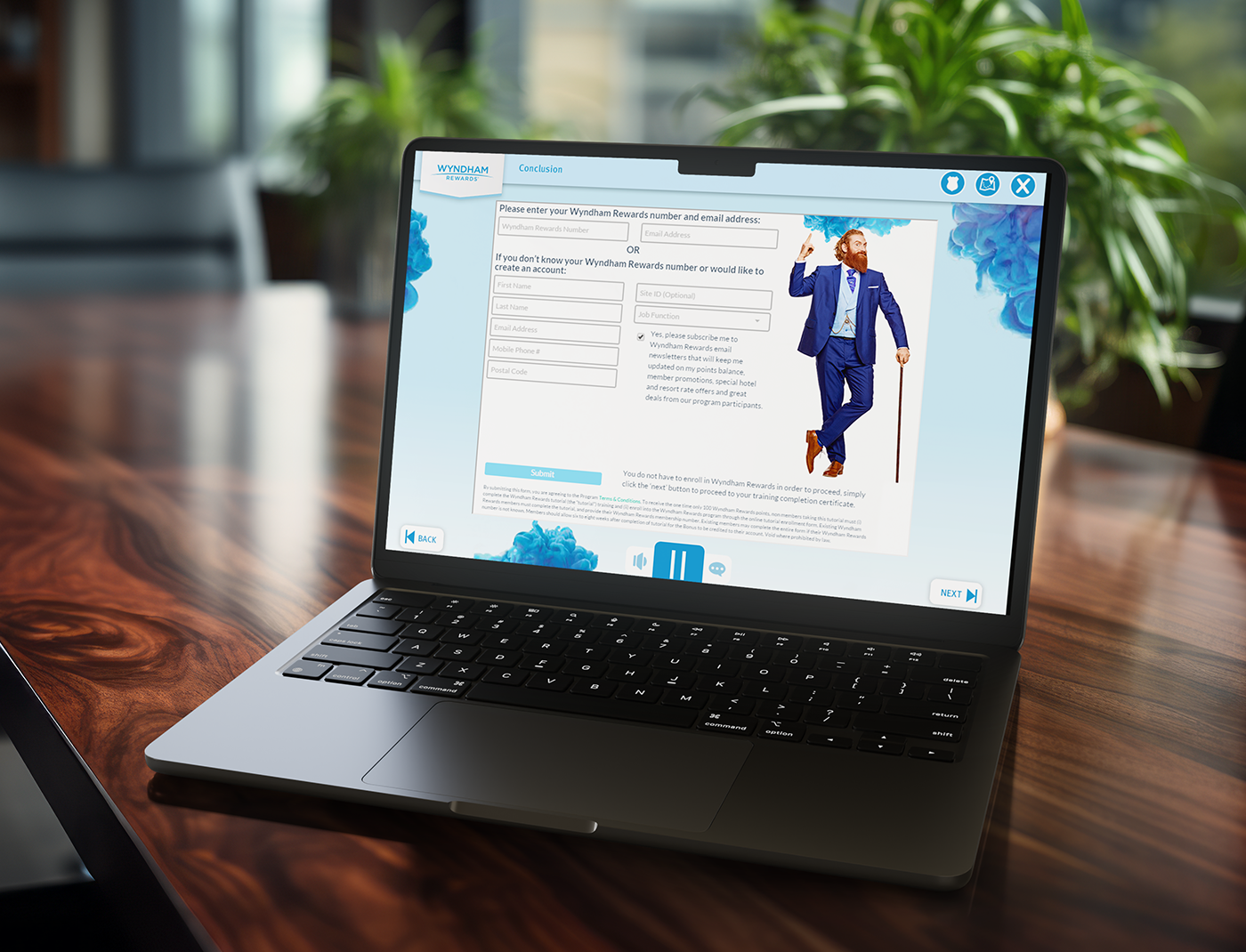 Designing Digitally - A laptop on a wooden table displays a website form for entering a Wyndham Rewards number and email. The background includes a potted plant near a window, complementing the scene as part of the customer rewards training program for Wyndham Hotels. Designing Digitally -
